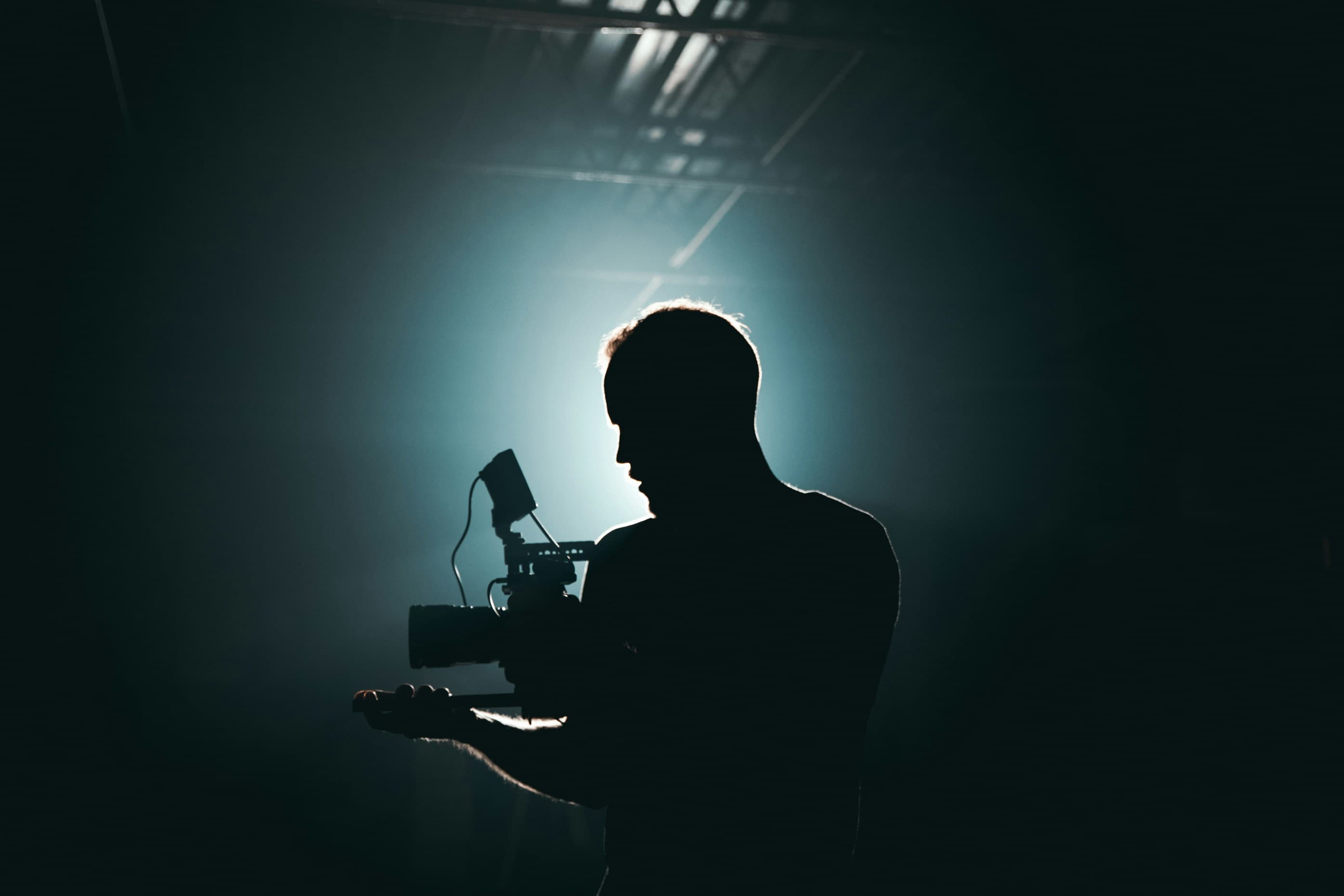 Silhouette of a camera operator — the framework that lets Maximum Pixels deliver consistently