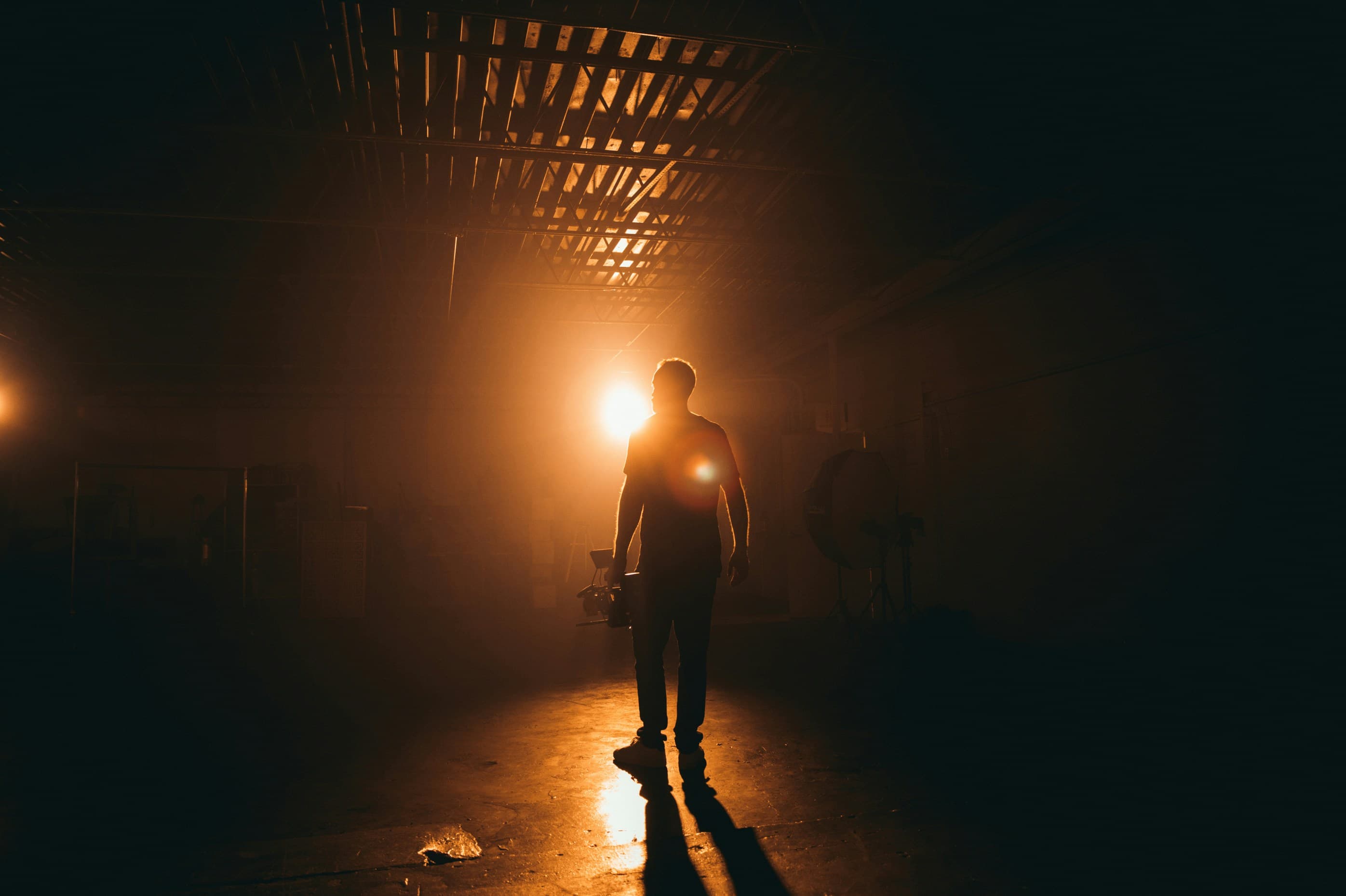 A silhouette walking toward the light — talk to the Maximum Pixels team today